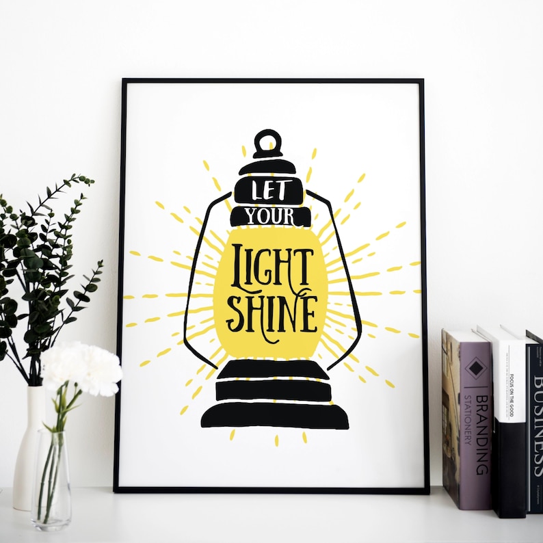 May include: Black and yellow printable wall art featuring a lantern with the text "Let your light shine".
