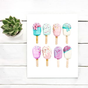 May include: Watercolor painting of nine colorful ice cream bars on wooden sticks. The ice cream bars are in various pastel colors, including pink, blue, and white, and are decorated with sprinkles and drizzles. The artwork is on a white background.
