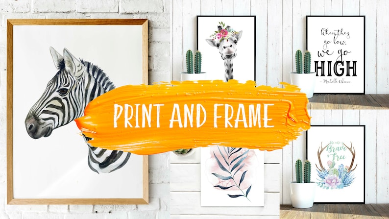 May include: A collection of four framed prints featuring watercolor illustrations of a zebra, giraffe, a tropical leaf, and a floral arrangement with antlers. The prints are displayed on a white brick wall with a yellow paint stroke overlayed on the image that says "PRINT AND FRAME".