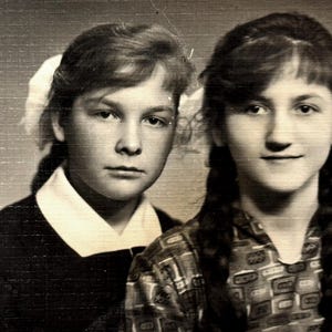Vintage female portrait two young pretty women chic hair braids schoolgirls students snapshot 1960s snapshot photography