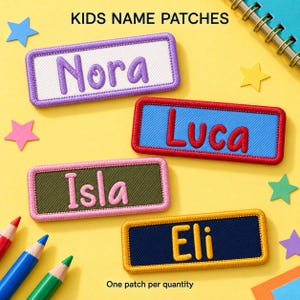 May include: Four rectangular embroidered name patches with stitched borders. The patches feature the names Nora in purple, Luca in red, Isla in pink, and Eli in yellow, set against white, blue, olive green, and navy blue backgrounds.
