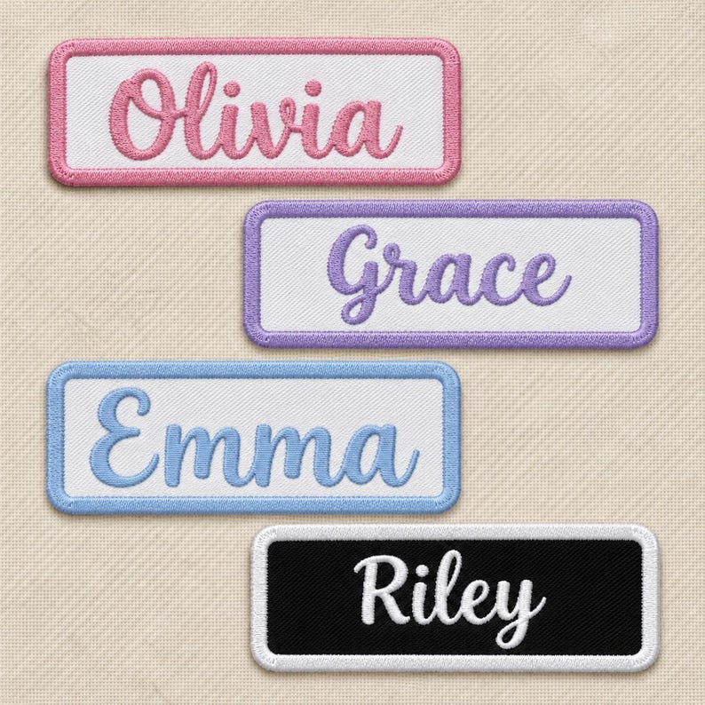 Four cursive name patches on cream fabric: Olivia in pink, Grace in purple and Emma in light blue on white, plus Riley in white on black. Each rounded rectangular patch has a border matching its lettering.
