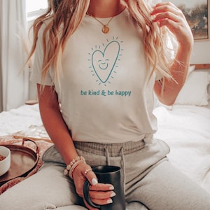 A heart with a smiling face on a t-shirt.