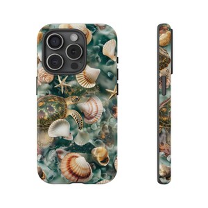 May include: A green, blue, and brown phone case with a sea turtle and seashells design.