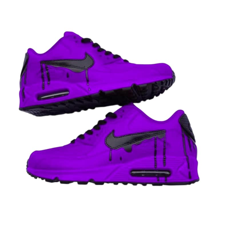 May include: Two pairs of purple trainers with black detailing. The shoes have a black Nike swoosh and a black dripping paint design. The soles and laces are black. The shoes are set against a white background.