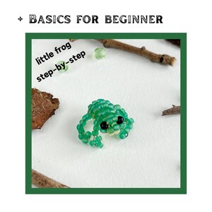 May include: A green beaded frog with black eyes. The frog is sitting on a white surface. The text "little frog step-by-step" is written in green letters on a white background.