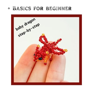May include: A handmade red beaded baby dragon with black eyes and gold accents. The dragon is held in a hand. Text on the image reads "+ BASICS FOR BEGINNER" and "baby dragon step-by-step".