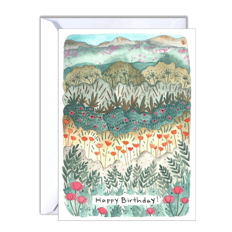 May include: A watercolour Happy Birthday card showing a layered landscape of green, teal, and orange foliage with pink flowers. The card has a white envelope and the text "Happy Birthday!" at the bottom.