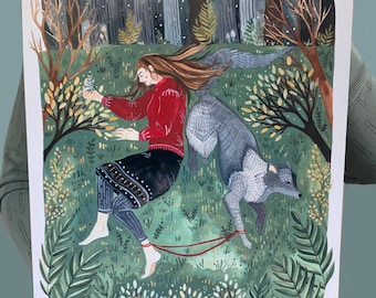 May include: A rectangular art print featuring a painted illustration of a person with long brown hair wearing a red sweater and black skirt, lying on green grass next to a grey wolf. A thin red leash connects the person to the wolf in a forest.