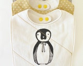 Penguin baby bib made with organic cotton and flannel.