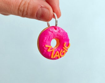 Donutförmige Erkennungsmarke für Haustiere. Personalisierte 3D-Identifikation, inspiriert von den Simpsons-Donuts