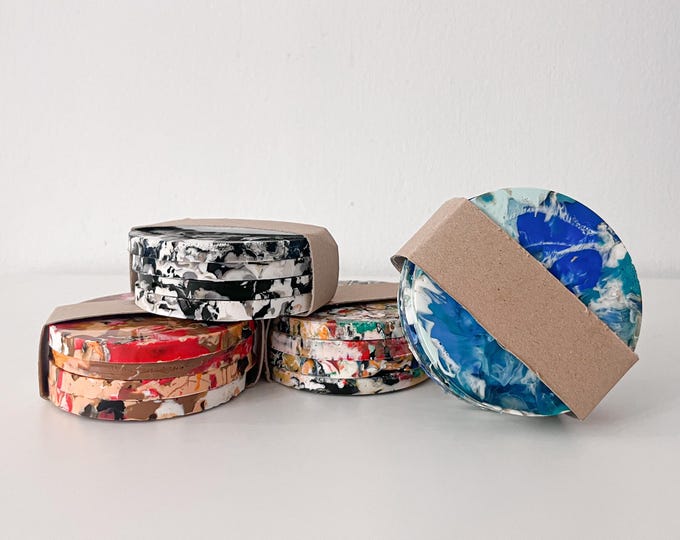 Set of 4 round coasters made of 100% recycled plastic. Handmade sustainable gift.