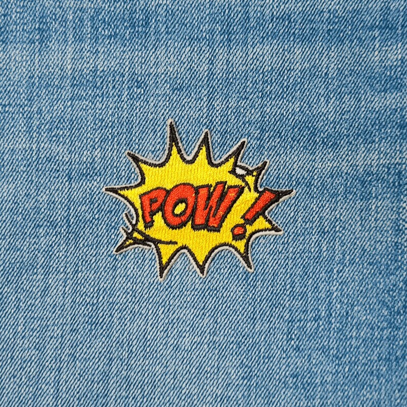 May include: Yellow and red embroidered patch with the word "POW!" in a comic book style.