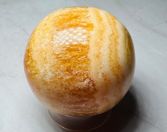 Orange kalcitsfär 3,8 cm | Kristalldekor | Orange | Vit | Gul | Klot | Boll | Läkande | Gåva