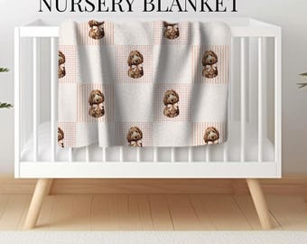 May include: A white baby crib with a custom dog nursery blanket. The blanket features a repeating pattern of brown dogs with bows on a pink and white checkered background. The text "CUSTOM DOG NURSERY BLANKET" is at the top.