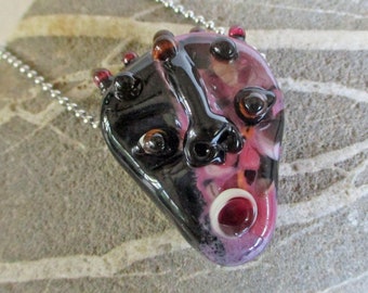 Pink glass face bead, Mask necklace pendant, pink & black sculptural amulet, lampwork glass bead totem focal glassbead, Isinglass Design