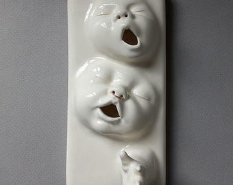 Long wall tile w/ 2 faces and 1 hand w/nosering, Handcrafted, low fire clay, Susan Kniffin Davidson Ceramics, Kniffin Pottery