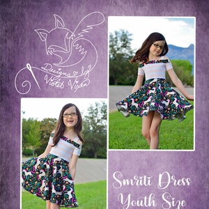 Puede incluir: Una niña pequeña lleva un vestido de tirantes con rayas blancas y rosas y una falda con estampado de unicornio. El vestido es de Designs by Violet Vixen y se llama Smriti Dress Youth Size.