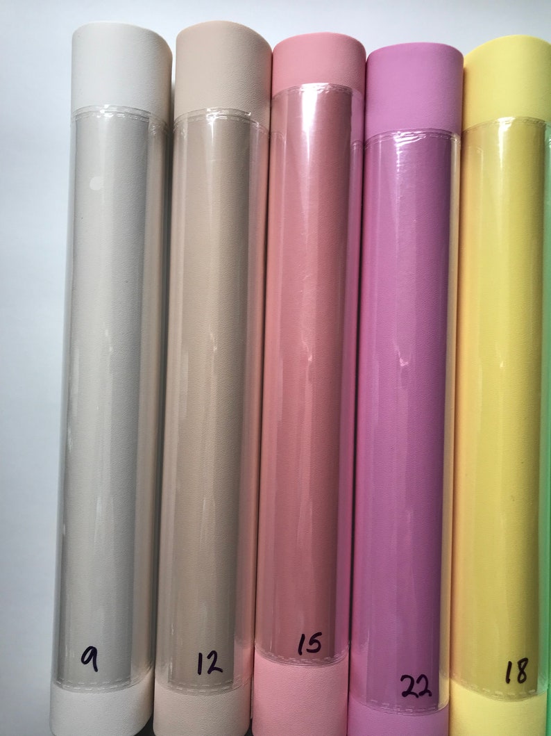 May include: Five rolls of colored paper wrapped in clear plastic. The rolls are labeled with numbers: 9, 12, 15, 22, and 18.