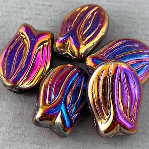 May include: Five iridescent glass beads in the shape of a tulip. The beads are a mix of purple, blue, and gold.