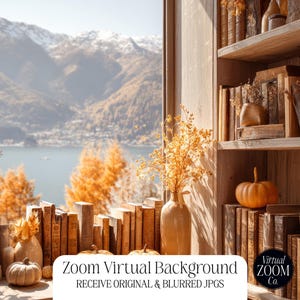 May include: A Zoom virtual background featuring a cozy autumn scene. The image showcases a wooden bookshelf filled with vintage books, pumpkins, and vases with dried flowers. The background reveals a scenic view of a lake and mountains.