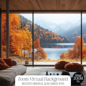 May include: A modern living room with large windows overlooking a lake and mountains. The room features a white couch with orange pillows, two orange beanbag chairs, and a coffee table with a vase of flowers. The windows are framed by wooden beams and the walls are painted a light gray. The text "Zoom Virtual Background Co." is visible in the lower right corner of the image.