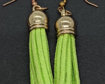 Small, light green faux suede tassel earrings