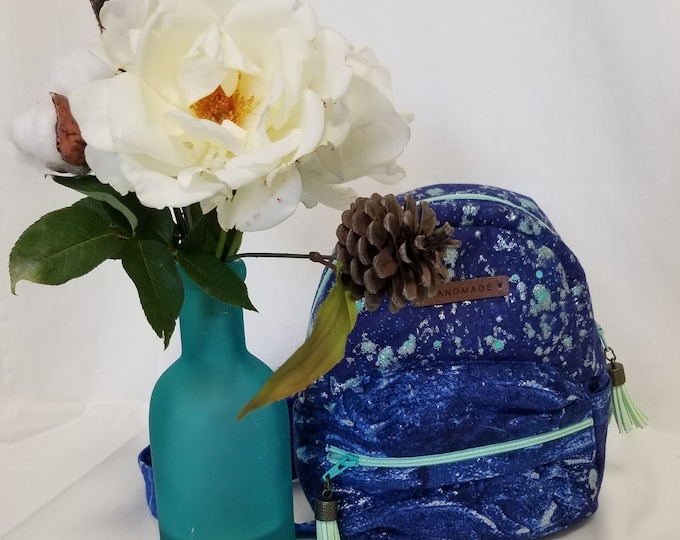 Mini Backpack with two big ways to show off when going out.