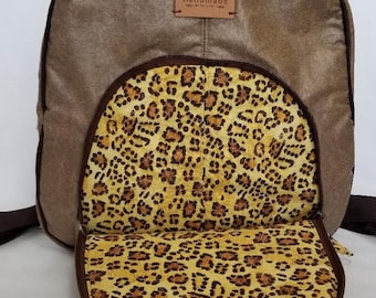 Faux leather purse backpack will put a tiger in your step.