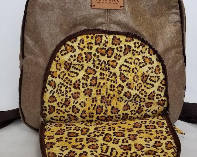 Faux leather purse backpack will put a tiger in your step.