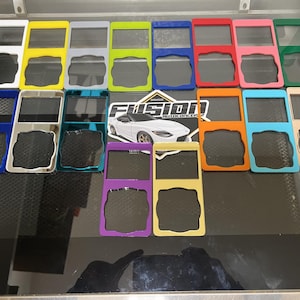 May include: Assortment of 12 blank, customizable nameplates in various colors, including blue, green, yellow, orange, pink, and white. Each nameplate has two rectangular spaces for text or images. The nameplates are arranged in three rows of four. The nameplates are made of a durable material and are perfect for adding a personal touch to any space.