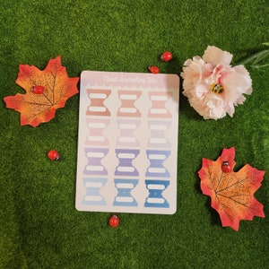 May include: A sheet of pastel colored cloud shaped journaling tabs with the text "Cloud Journaling Tabs" at the top. The tabs are in a gradient of pink, purple, blue and light blue.