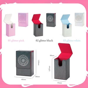 May include: Collection of glitter card storage boxes in pink, black, and white. The boxes have a flip-top design with contrasting interior colors. Dimensions are shown in millimeters: 135mm high, 85mm wide, and 50mm deep.