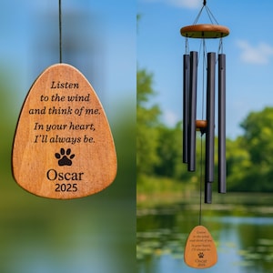 May include: Wooden wind chime with black tubes and a wooden top. The chime includes a wooden pendant with the text "Listen to the wind and think of me. In your heart, I'll always be. Oscar 2025" and a paw print.
