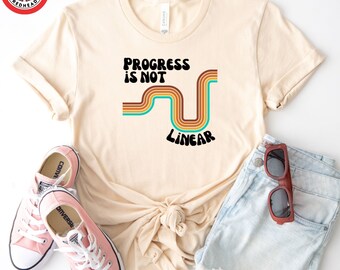 Camiseta "El progreso no es lineal": Camiseta gráfica motivacional