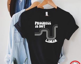 Camiseta "El progreso no es lineal": Camiseta gráfica unisex motivacional