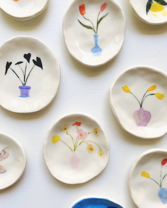 Hand-painted porcelain trinket dishes with 723 favorites — that demand signal proves these delicate, original painted ceramics have real fan appeal.