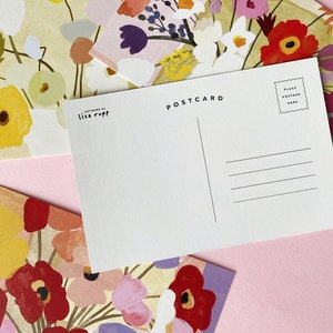 A set of brightly colored floral postcards by Lisa Rupp.