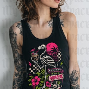 May include: Black tank top featuring a skeleton flamingo holding a skull cocktail, with a pink sunset and palm trees. The graphic includes the text "WELCOME TO PARADISE" and pink hibiscus flowers.
