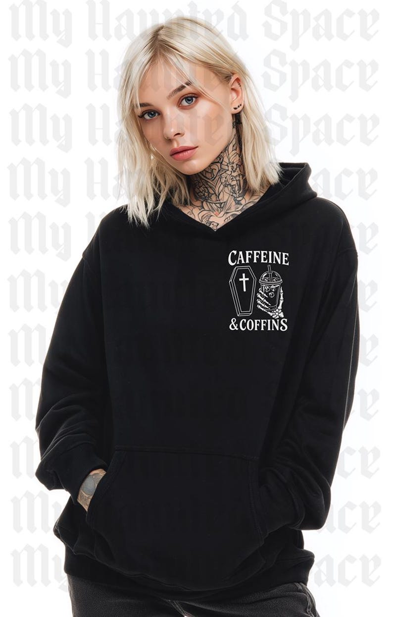 May include: Black hoodie with a front pocket and a hood. The hoodie features the text "CAFFEINE & COFFINS" with a coffin and a coffee cup graphic. The model is wearing the hoodie.