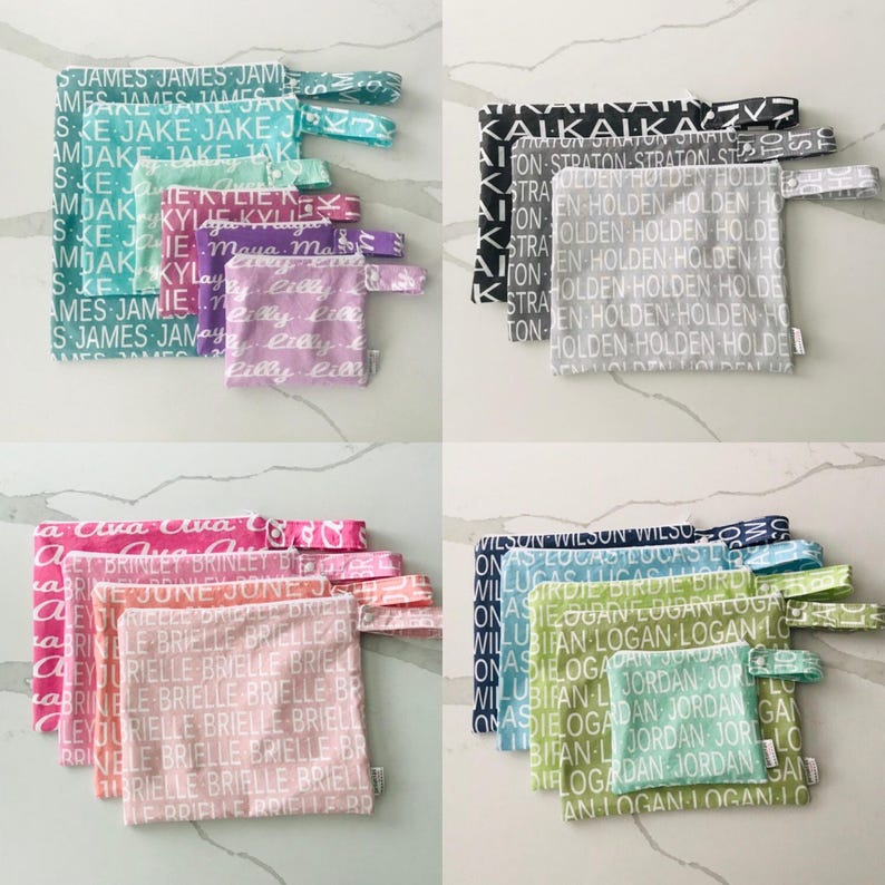 May include: A set of 10 colorful zippered pouches with various names printed on them. The pouches are made of fabric and have a drawstring closure. The pouches are arranged in two rows of five.
