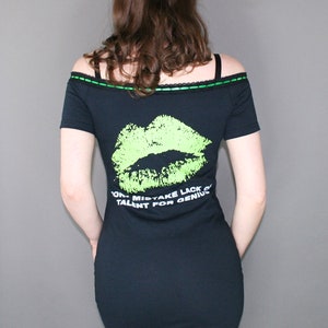 Off shoulder dress Type O Negative shirt, modified for a flattering female fit and style. This dress has black insertion lace on the shoulder with green, satin ribbon. Ribbon can be adjusted for a different look or removed. Black lace on the hem.