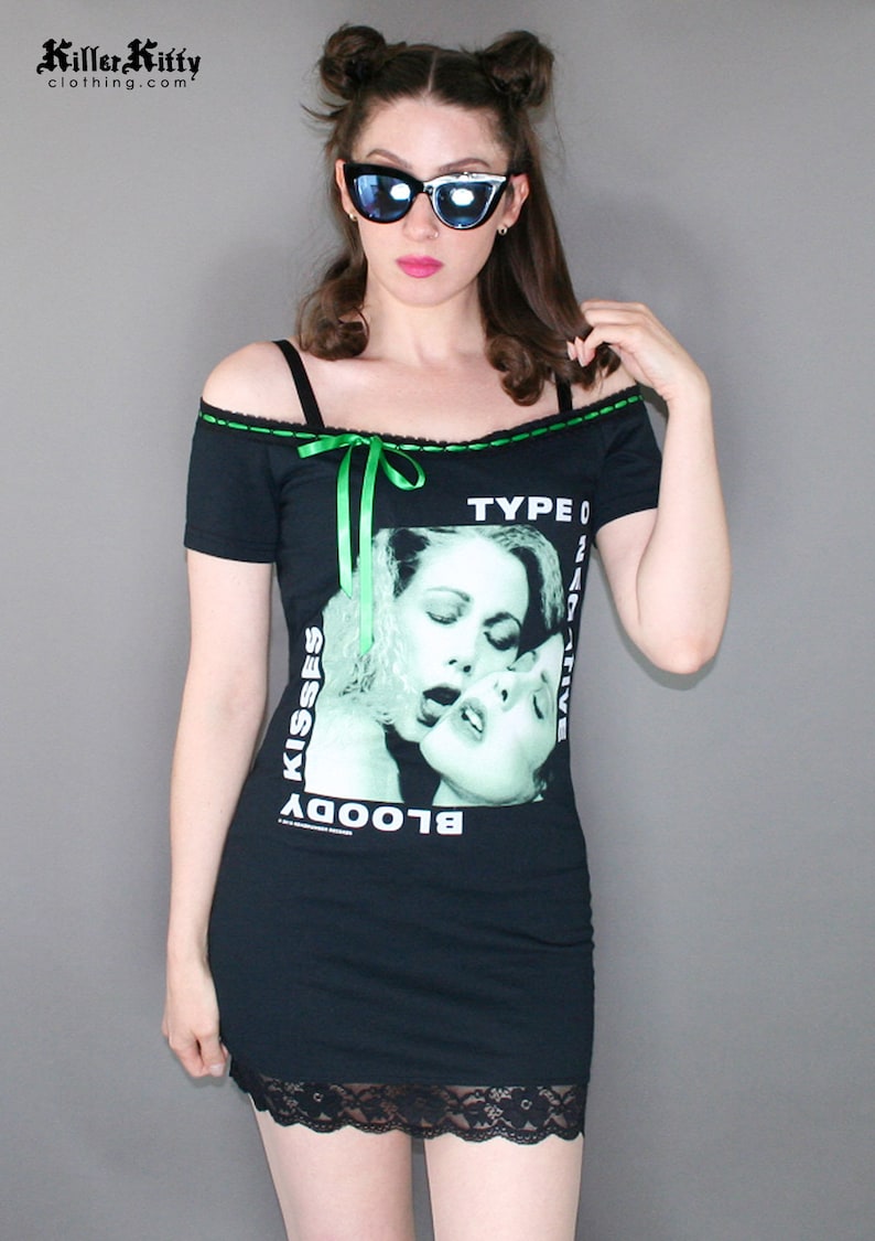 Off shoulder dress Type O Negative shirt, modified for a flattering female fit and style. This dress has black insertion lace on the shoulder with green, satin ribbon. Ribbon can be adjusted for a different look or removed. Black lace on the hem.