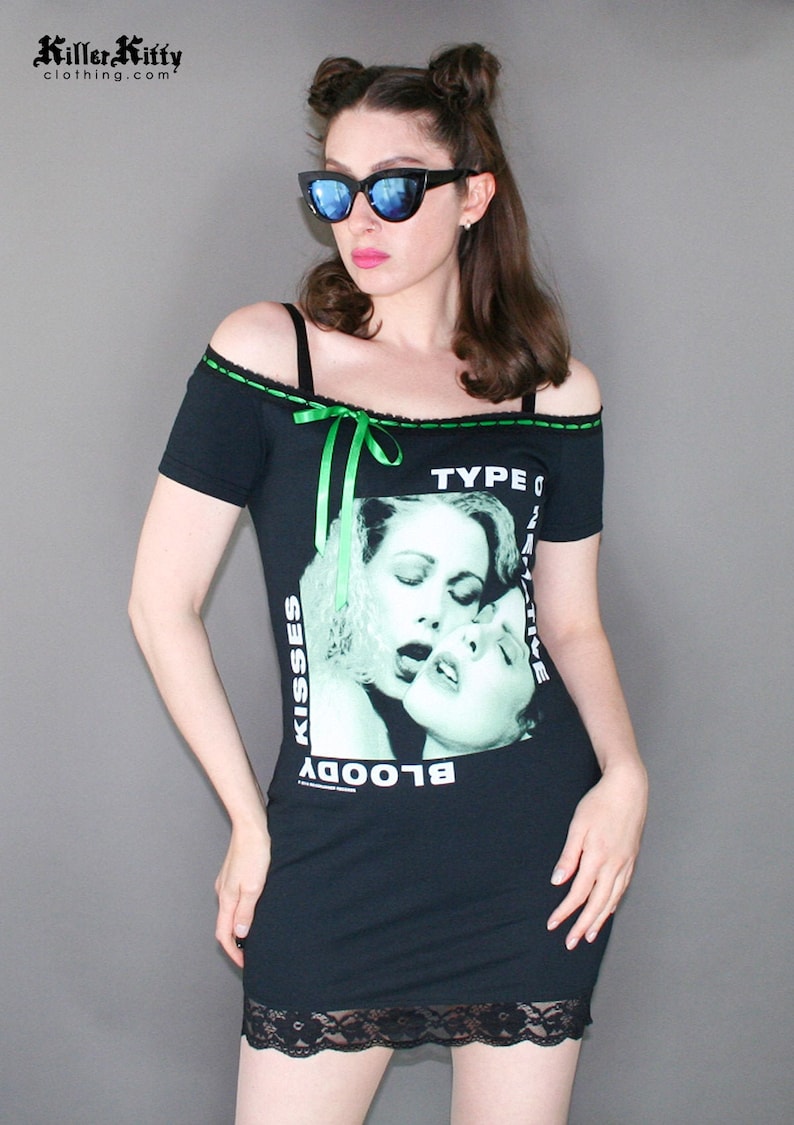 Off shoulder dress Type O Negative shirt, modified for a flattering female fit and style. This dress has black insertion lace on the shoulder with green, satin ribbon. Ribbon can be adjusted for a different look or removed. Black lace on the hem.