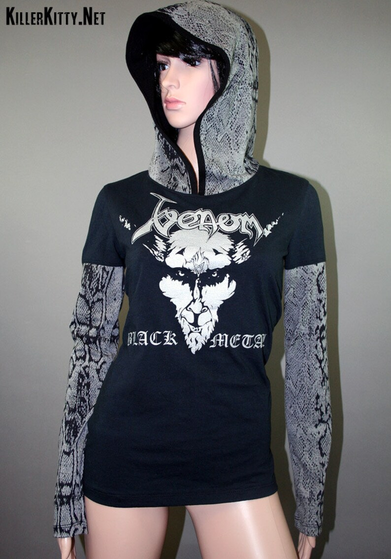 Pullover hoodie made from upcycled Venom shirt, modified for a flattering female fit and style. The hood and sleeves are in black and gray snake print. The hood is lined in black knit and the hem is coverstitched.