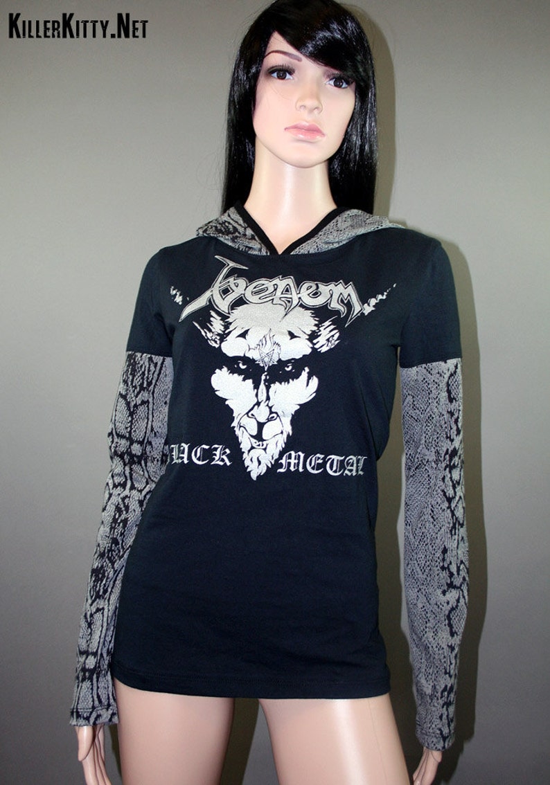 Pullover hoodie made from upcycled Venom shirt, modified for a flattering female fit and style. The hood and sleeves are in black and gray snake print. The hood is lined in black knit and the hem is coverstitched.