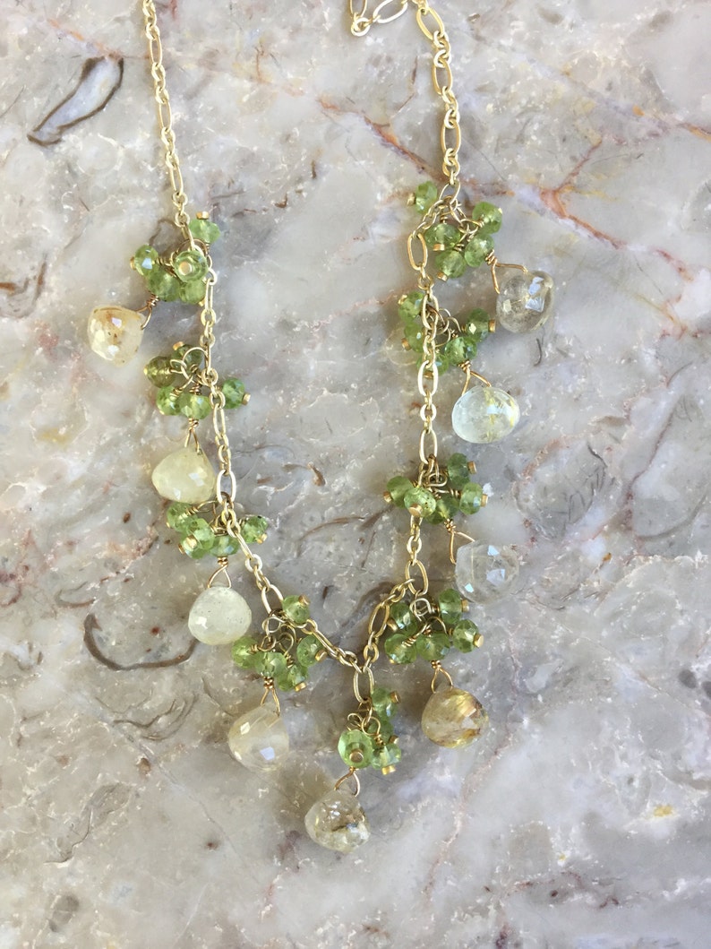 Rutilated quartz dangle necklace with peridot clusters