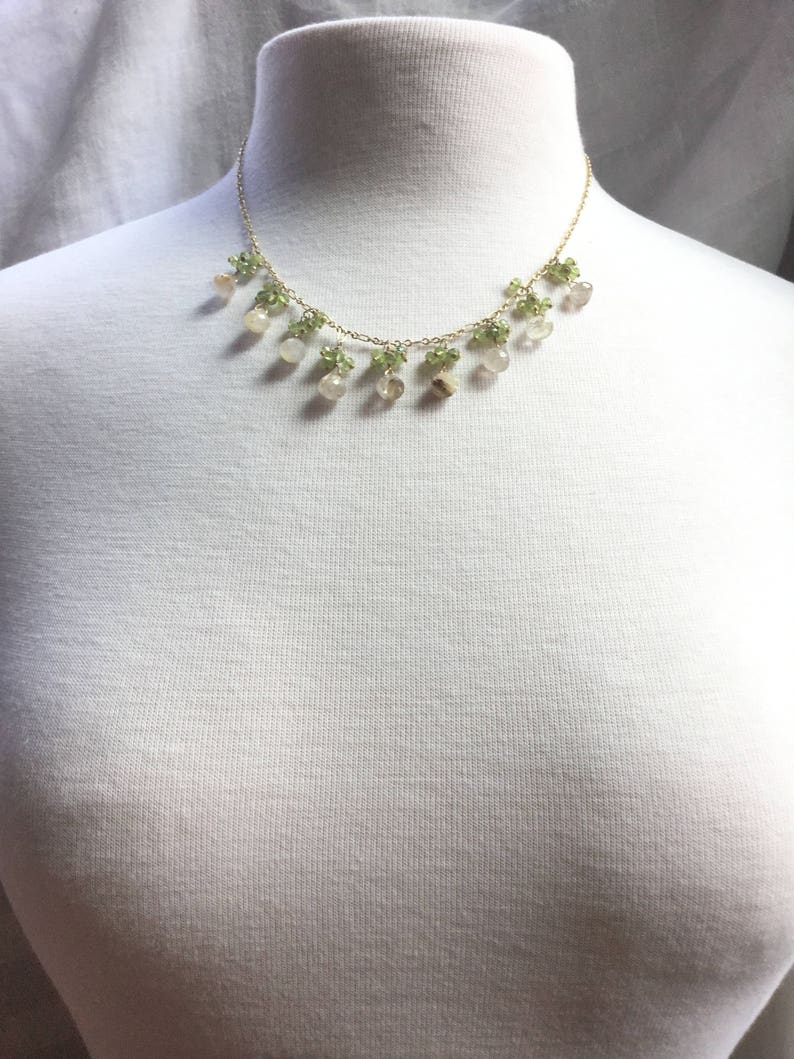 Rutilated quartz dangle necklace with peridot clusters