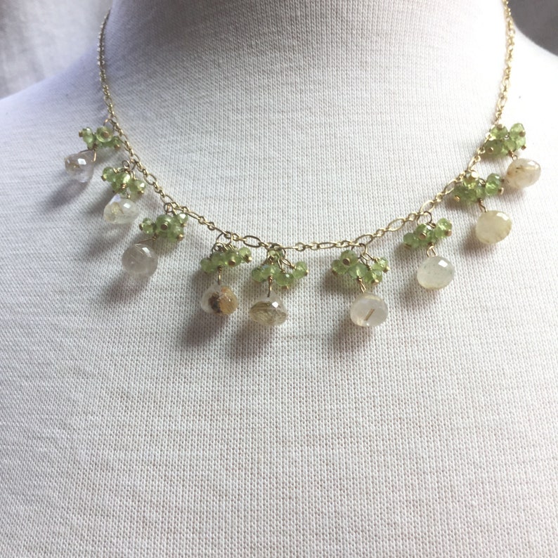 Rutilated quartz dangle necklace with peridot clusters