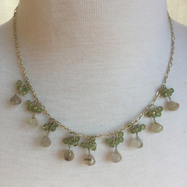 Rutilated quartz dangle necklace with peridot clusters